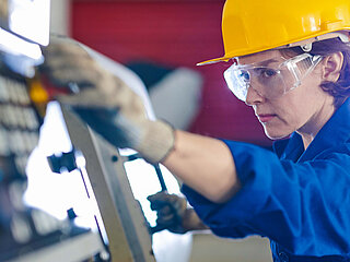 Zehnder Equality zehnder employee women is working on a mashine